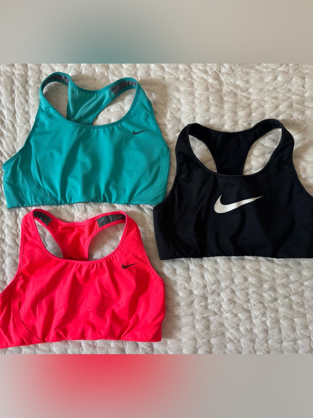 3 Nike Women’s Racerback Work Out Bras. Hot pink, teal, & black